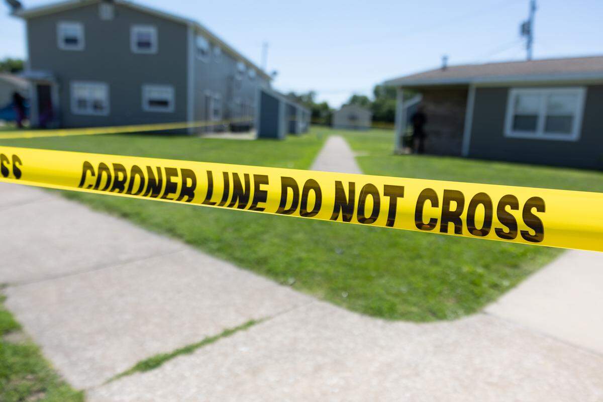 Yellow police tape blocks off the scene of a suspected homicide at the Thomas Terry apartment complex in Brooklyn on Tuesday.
