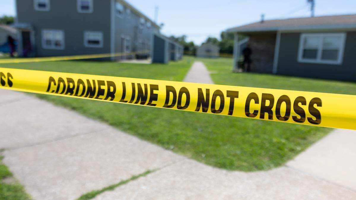 Yellow police tape blocks off the scene of a suspected homicide at the Thomas Terry apartment complex in Brooklyn on Tuesday.