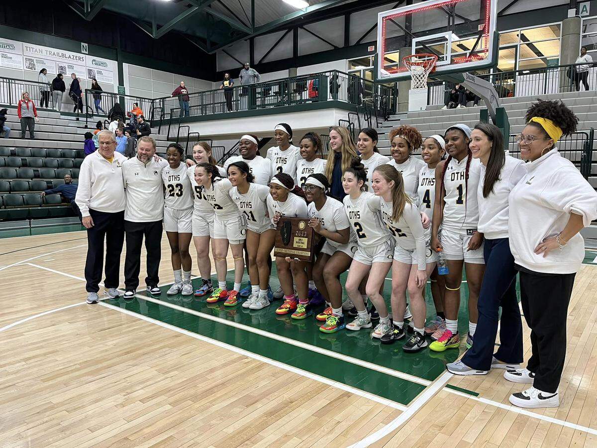 The O’Fallon girls basketball team poses following their 65-48 win against Bolingbrook at the IHSA Class 4A Bloomington Super-Sectional on Monday night. The Panthers now advance to the state tournament where they’ll play at 2:30 p.m. Friday, March 3.