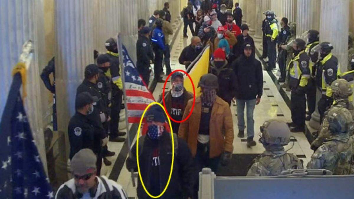 Two men identified by the FBI as Justin LaGesse of McLeansboro (red circle) and Theodore Middendorf, also of McLeansboro, (yellow circle) march through the U.S. Capitol on Jan. 6, 2021.