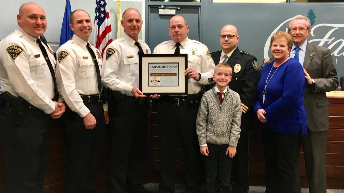 The O’Fallon Police Department has been accredited by Illinois Association of Chiefs of Police and an awards ceremony was held during the City Council meeting on Dec. 3. Pictured left to right: Lt. Kerry Andrews, Lt. Dave Matevey, Capt. James Cavins, Chief Eric Van Hook, Chief Dan Ryan of the Leland Grove Police Department, Leah Wilson, and Mayor Herb Roach, along with Ryan Lotz, who was Mayor for the Day.
