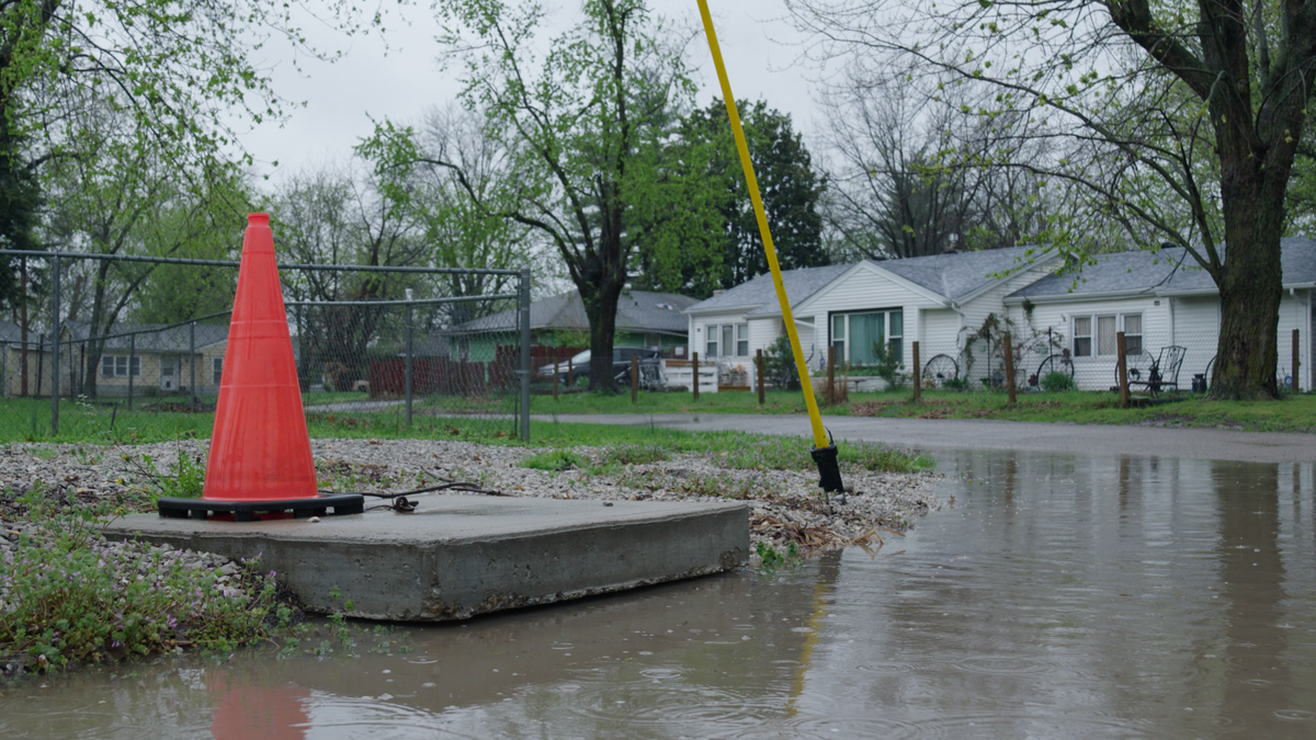 Water rises in the streets outside Patricia Greenwood’s house in the Piat Place neighborhood.