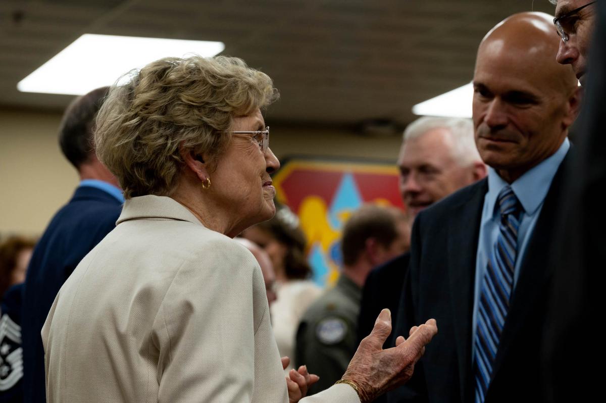 Joan Brown, spouse of the late Maj. Gen. Donald D. Brown, speaks to retired Gen. Carlton D. Everhart II, a previous commander of Air Mobility Command, during the Airlift/Tanker Association Hall of Fame ceremony for her husband on Scott Air Force Base. Gen. Brown was the A/TA Hall of Fame recipient for 2021 and a bust of his likeness was unveiled at the A/TA Memorial Walkway located near AMC headquarters.