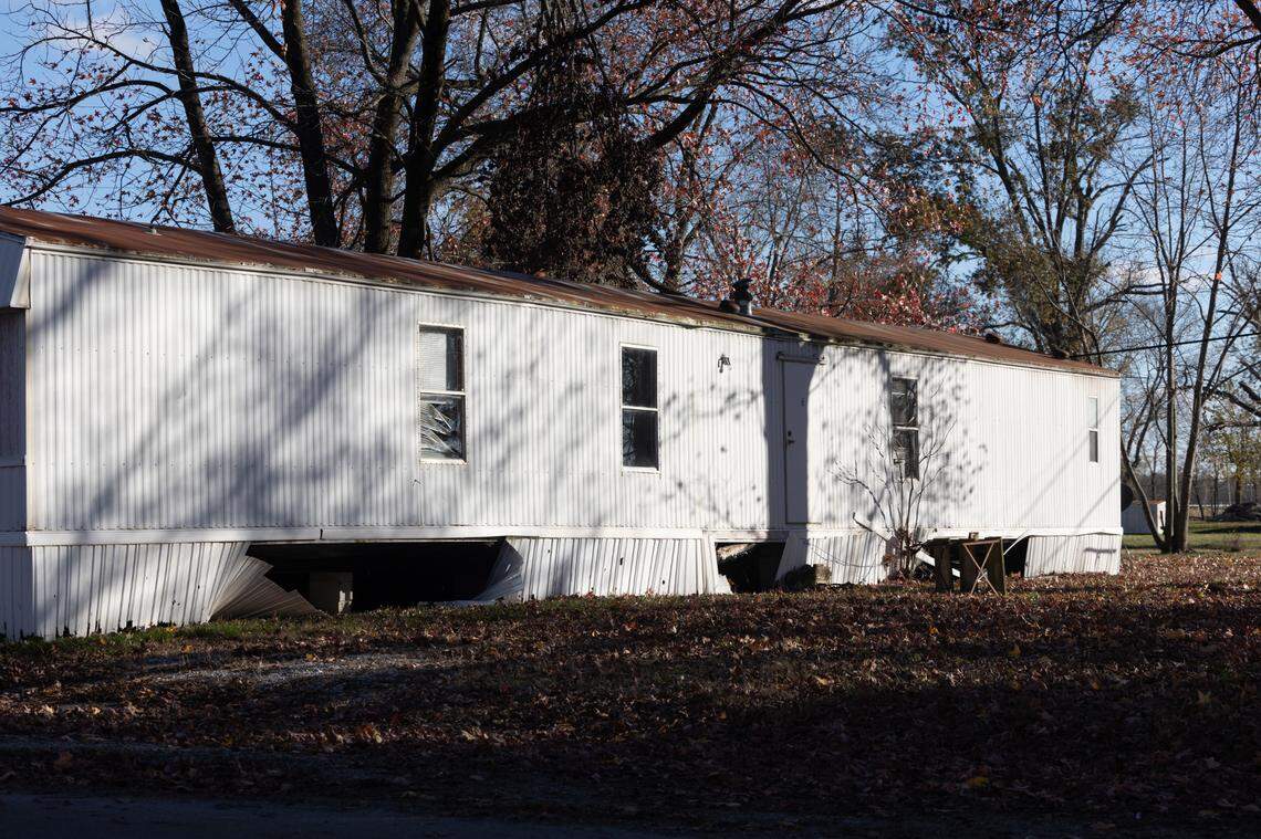A mobile home at Brookside Mobile Home Park has damaged skirting and blinds, a rusted roof and is missing exterior steps to reach its door. Brookside is owned by Homes of America LLC. It is located in rural Centralia.