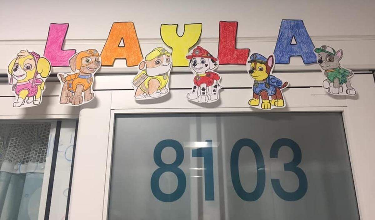 Nurses caring for 2-year-old Layla Thomas, of Belleville, put her name and doggie images above her door at St. Louis Children’s Hospital, where she’s been since March 18.
