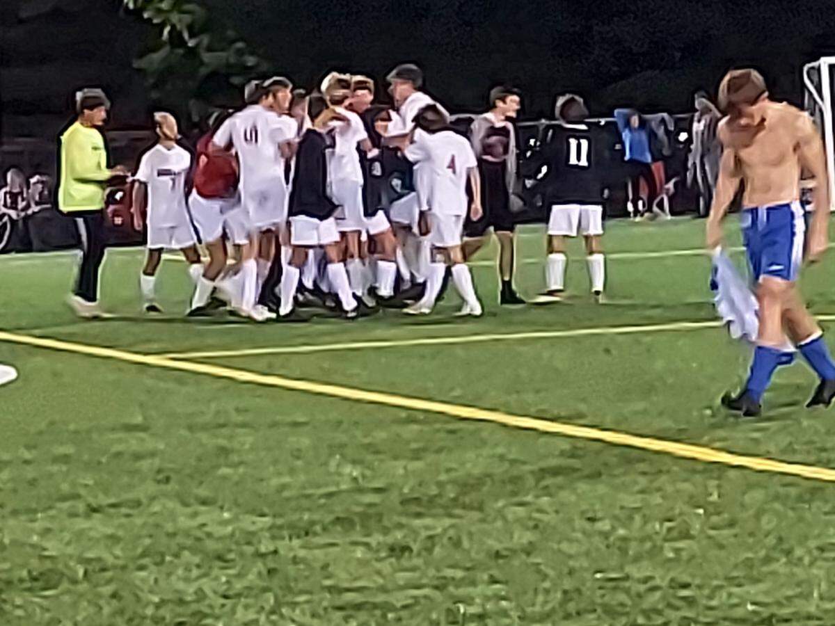 Highland’s soccer team celebrates their 3-2 double overtime win against Alton Marquette in the IHSA Class 2A Alton Marquette regional semifinals last season. The Bulldogs ultimately lost to Triad in double overtime in the regional championship and now have high expectations for the 2022 campaign.
