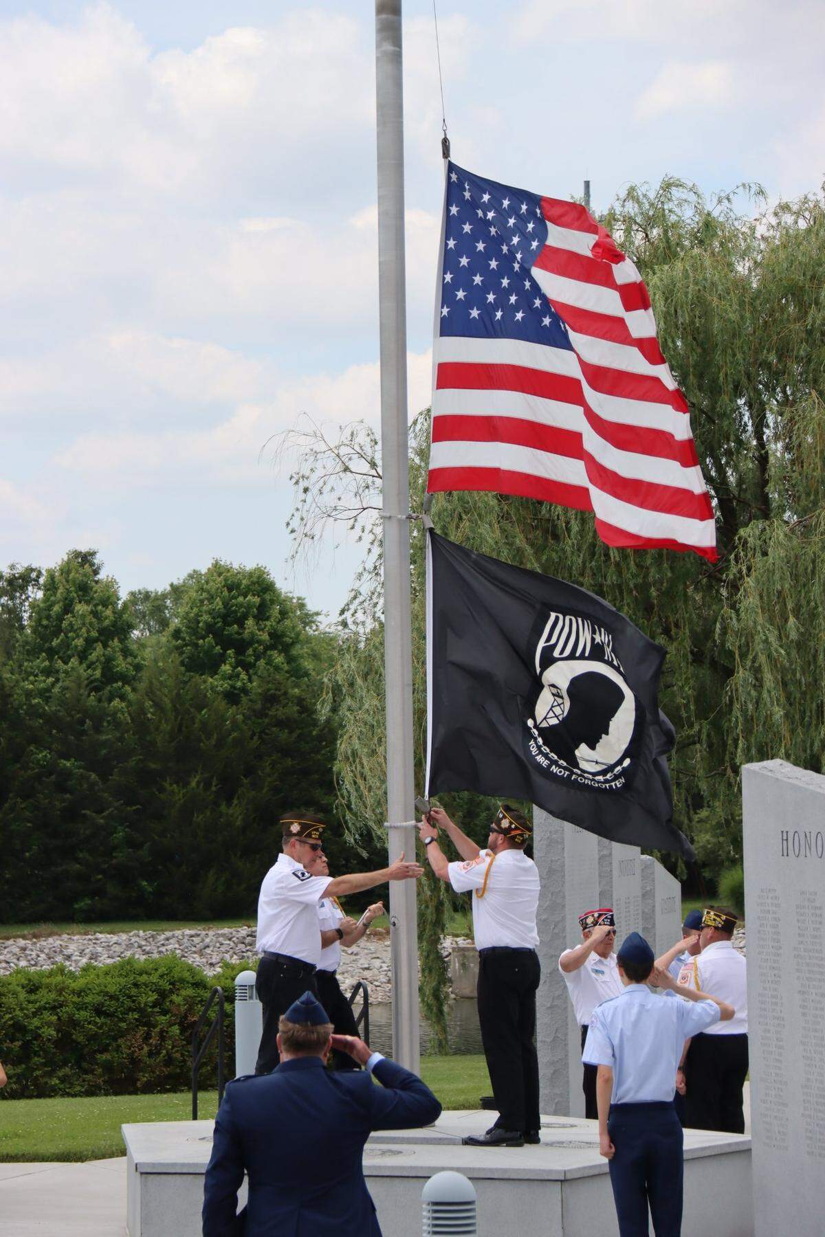 O’Fallon VFW Post 805 lowered and raised flags at the center flagpole during the Memorial Day program in O’Fallon. More than 150 spectators attended the event at the O’Fallon Veterans’ Monument sponsored by the city and the monument association this year.