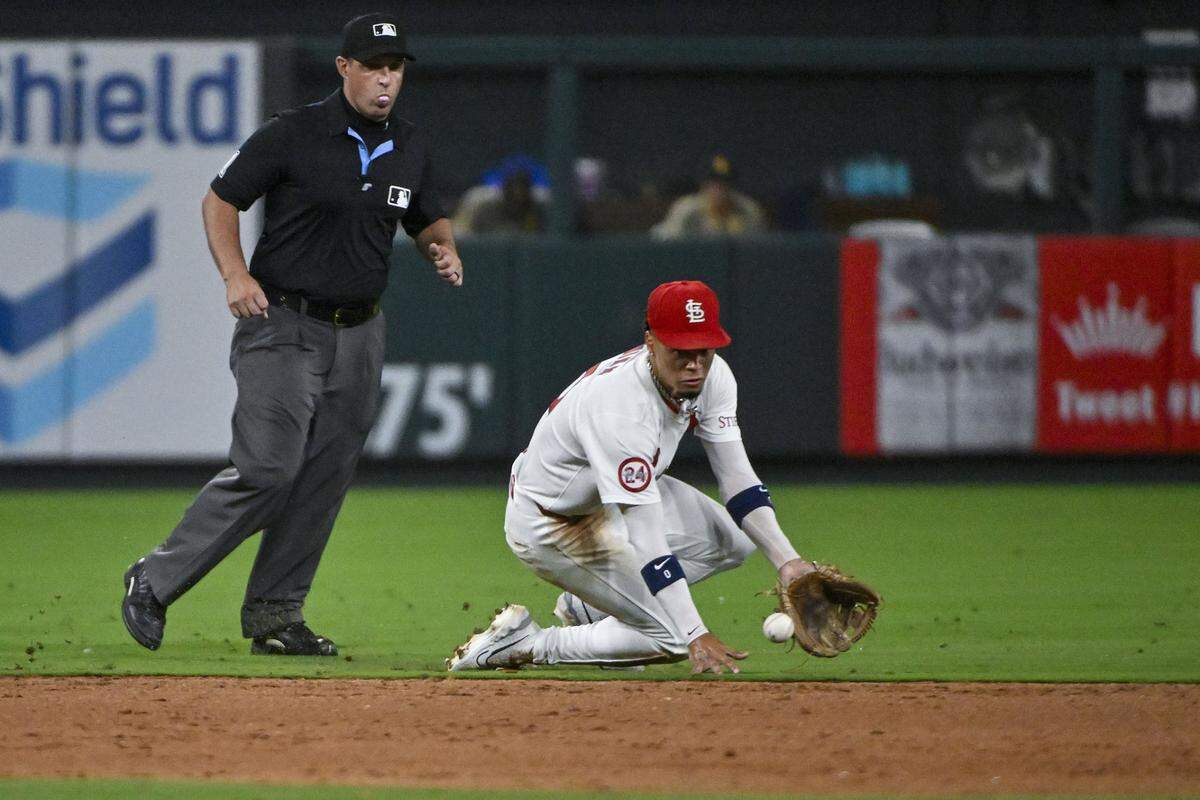 Aug 28, 2024; St. Louis, Missouri, USA;  St. Louis Cardinals shortstop Masyn Winn (0) fields a ground ball against the San Diego Padres during the eighth inning at Busch Stadium. Mandatory Credit: Jeff Curry-USA TODAY Sports