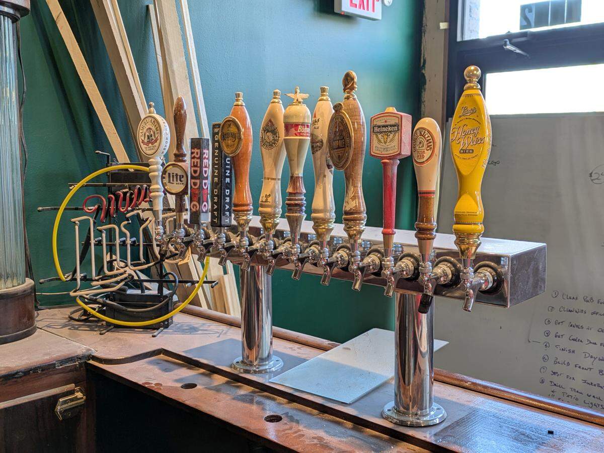 Beer taps were recently installed in the new section of the front bar at The Harp Pub. These handles, which McElligott already had on hand, are temporary placeholders.