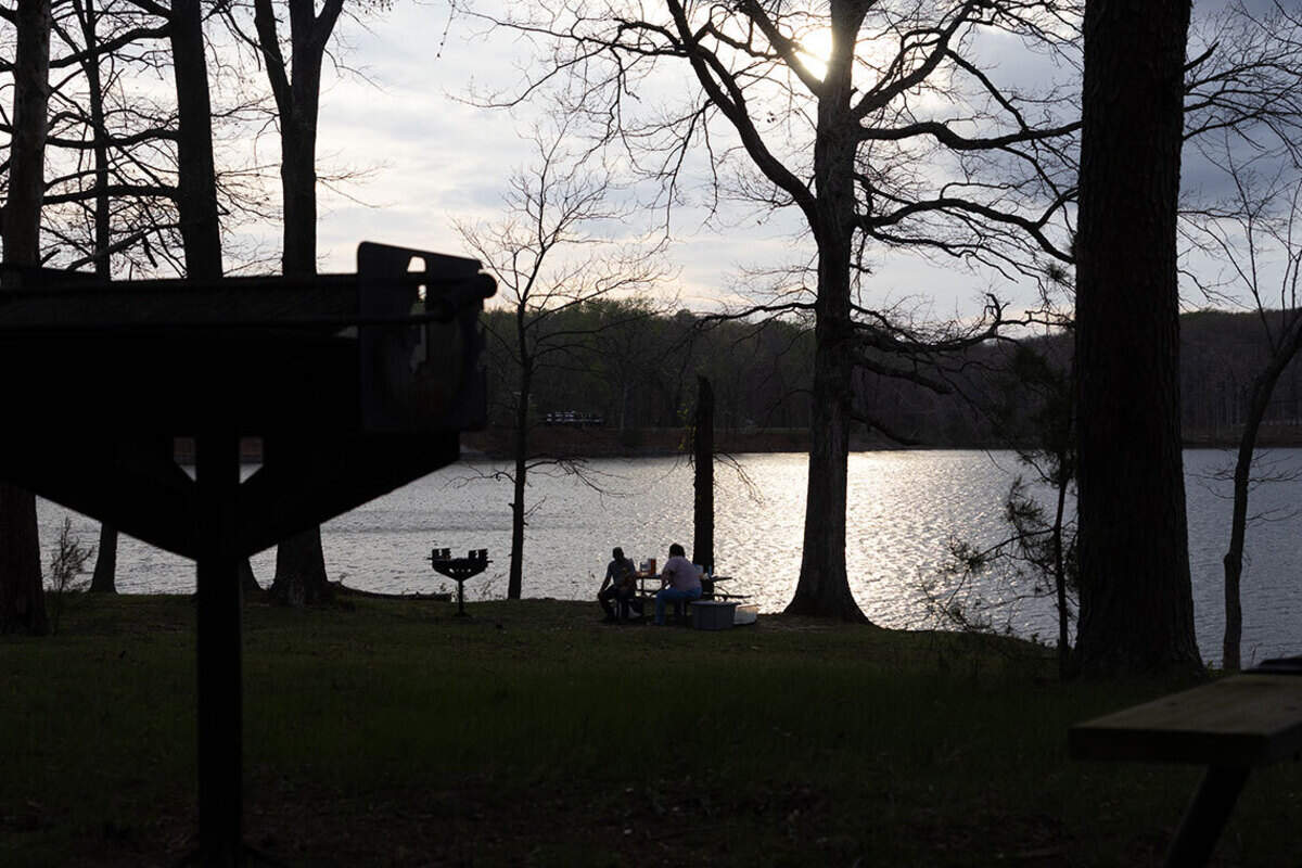 John Hall and his daughter Tori Rutherford enjoy the sun over Lake Murphysboro in April. Rutherford’s mother, Amanda Hall, still enjoys hiking and being out in nature despite an alpha-gal diagnosis.