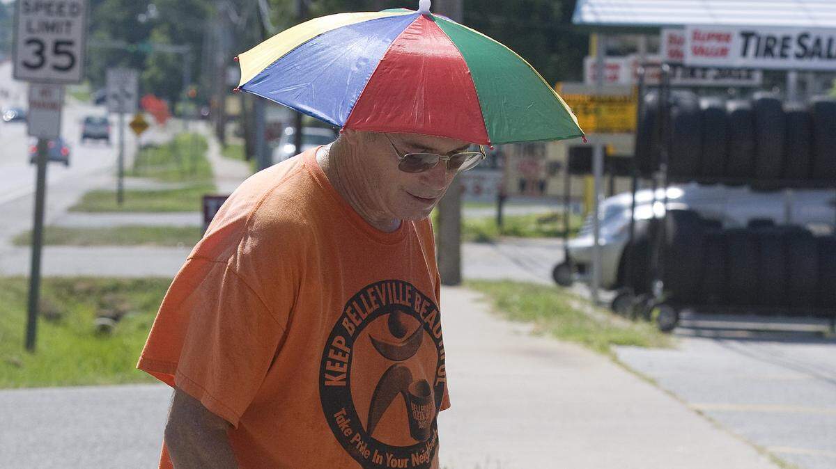 Alan Weiss of Belleville donned an umbrella hat to keep the heat off his head as he picked up litter along Sherman Avenue in Belleville. The Keep Belleville Beautiful City-Wide Litter Pick Up day is from 9 a.m. to noon Saturday, April 23, 2018. To volunteer, email info@basicbelleville.org or call 618-722-5822.