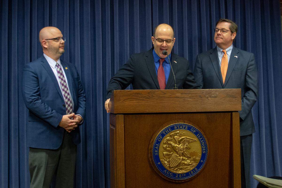 Rep. Mark Batinick, a Plainfield Republican, speaks at news conference Tuesday at the capitol in Springfield opposing a graduated income tax proposed by Gov. J.B. Pritzker. He is joined by Rep. Jeff Keicher (left), a Sycamore Republican, and Rep. Grant Wehrli, a Naperville Republican.