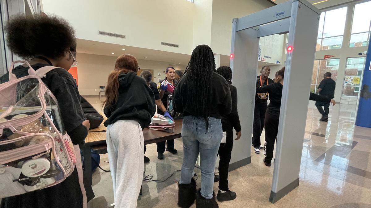 East St. Louis Senior High students file through metal detectors before the start of the school day on Thursday, Sept. 25. The district also has a clear backpack policy, and all bags are checked upon entry.