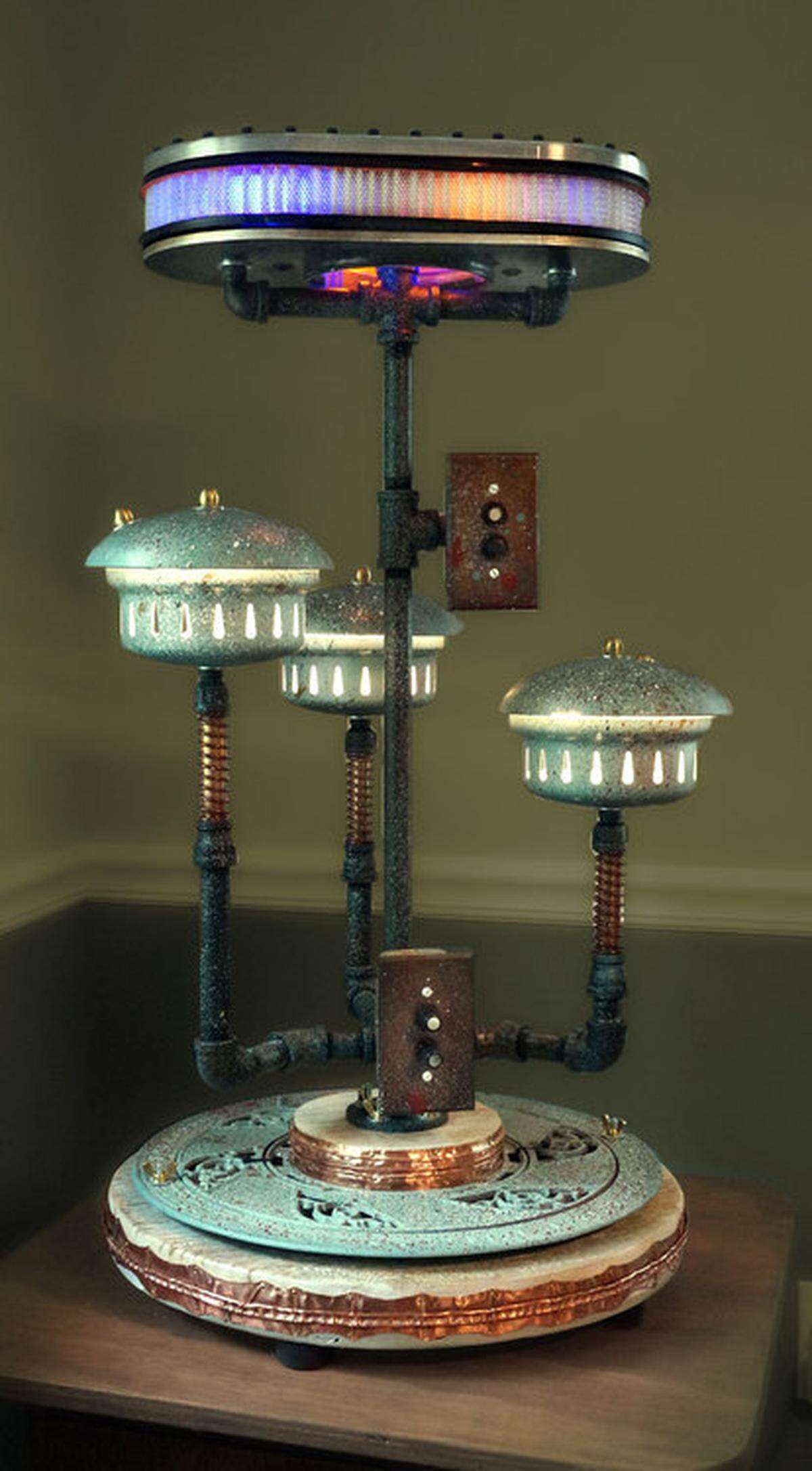 Steampunk and cyberpunk pieces, like this lamp, are the work of of Greg and Janey Brummett of Highland. The annual Art in the Park event will take place from 10 a.m. to 5 p.m. Saturday, Oct. 8, and from 11 a.m. to 4 p.m. Sunday, Oct. 9, at Lindendale Park in Highland.