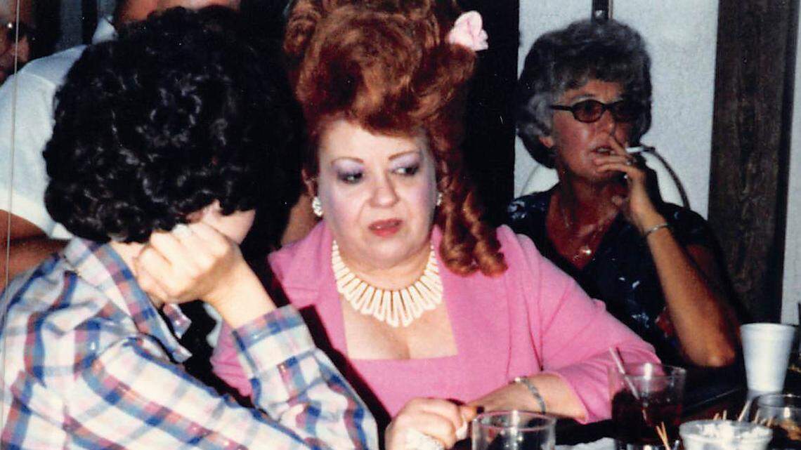 Lillian “Diamond Lil” Krupp at her restaurant with guests. Courtesy of Tom Green