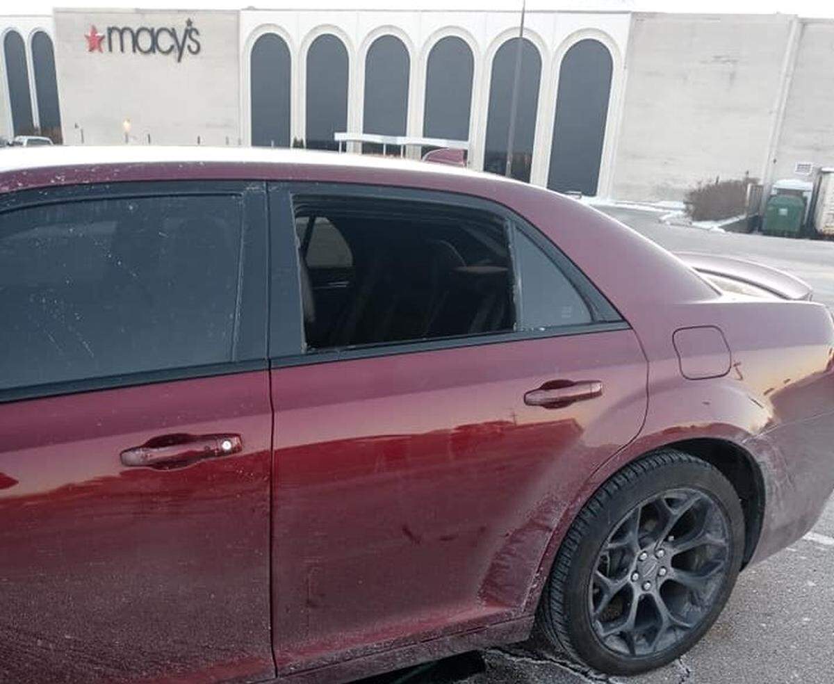 Thieves broke the rear window on the driver’s side of this Chrysler 300 in the parking lot of St. Clair Square shopping mall in Fairview Heights on Saturday and took some of its valuable contents.