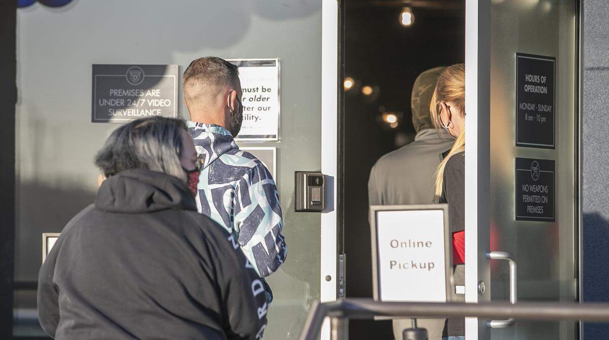 Some of the first customers enter BEYOND/HELLO cannabis dispensary, owned by Jushi Holdings, Inc., 1401 Mississippi Ave. in Sauget, Illinois after their grand opening. The legalized recreational cannabis store is located next to the popular Pop’s NightClub and concert venue and several adult entertainment venues.