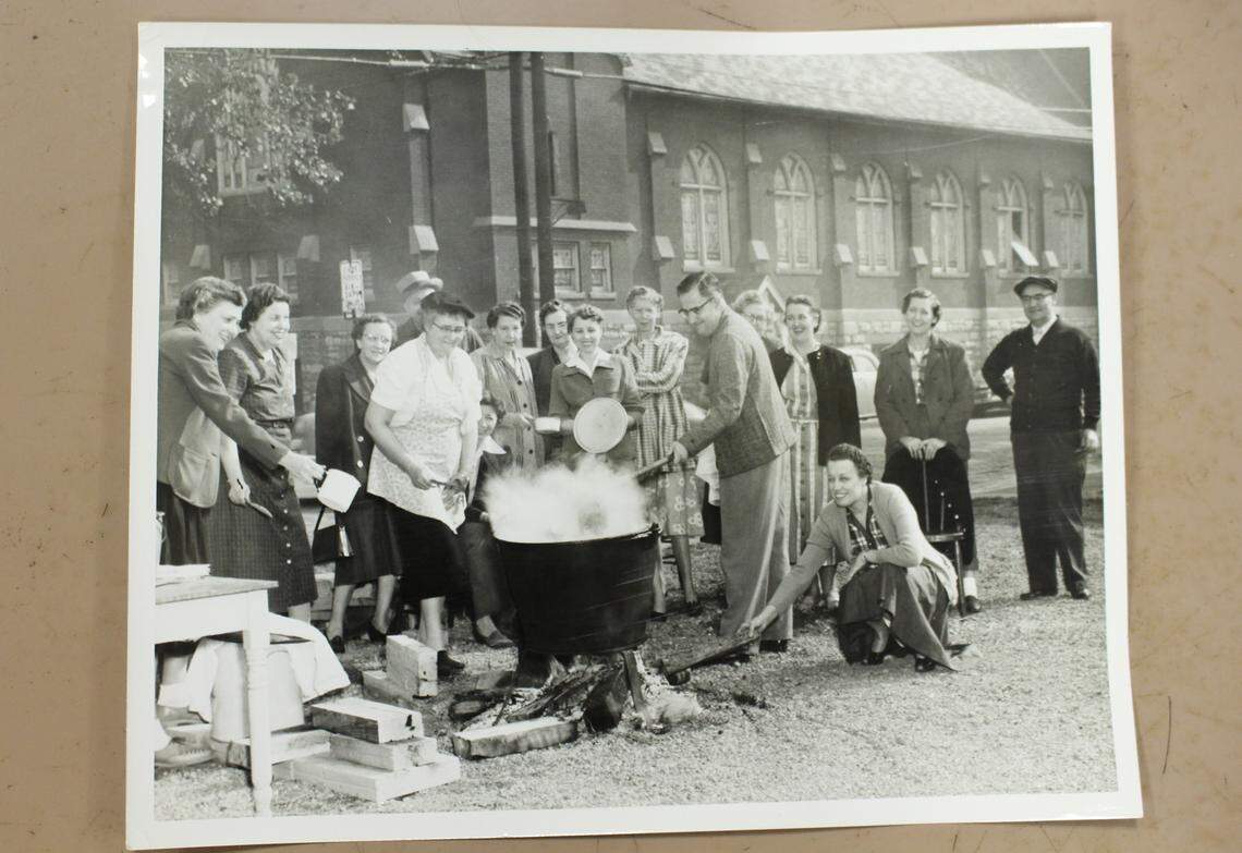 St. Peter Evangelical United Church of Christ in Granite City was once known for its apple butter. Here, members are shown stirring it in a big black kettle in 1954.