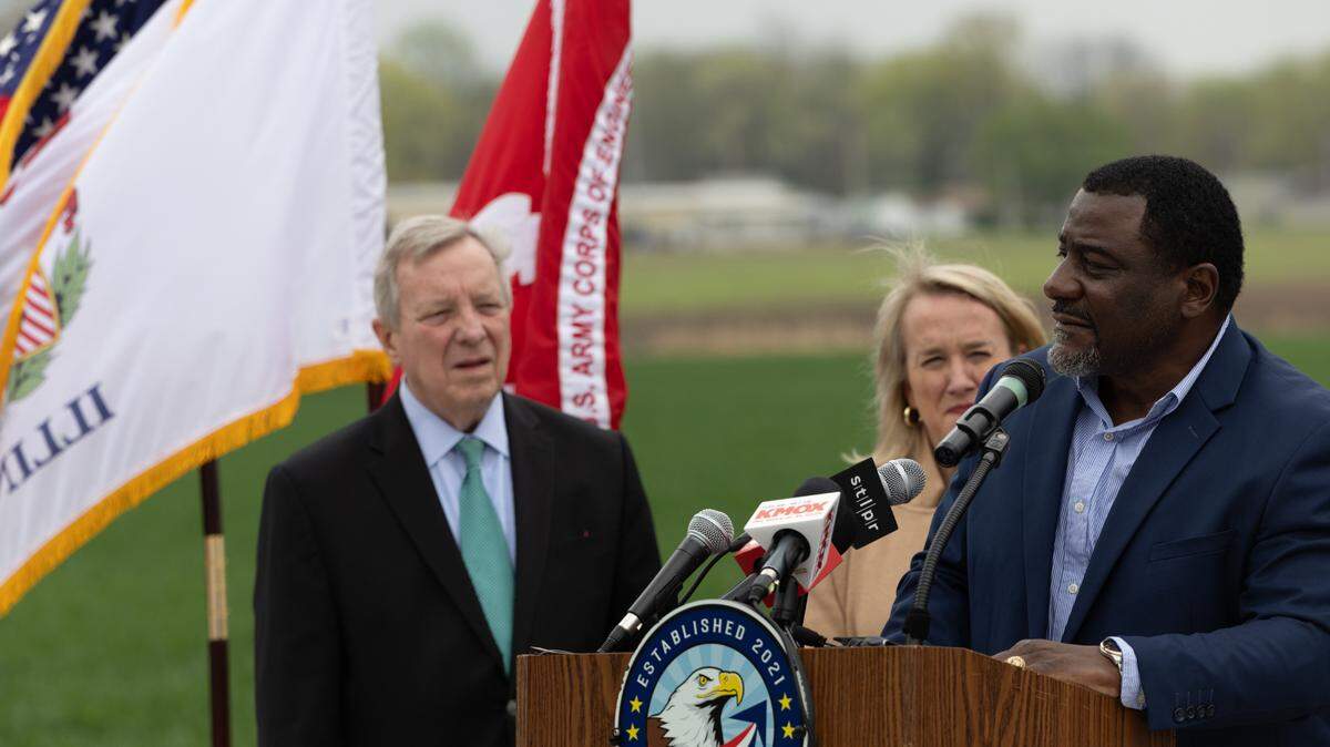 Cahokia Heights, Ill. mayor Curtis McCall Sr. speaks to a crowd of government officials, public works employees, journalists and citizens during a groundbreaking ceremony on April 1, 2024 for the city’s new sewer renewal project. In the background, U.S. Senator Dick Durbin (D-IL) and U.S. Rep. Nikki Budzinski (D-Springfield) watch on.
