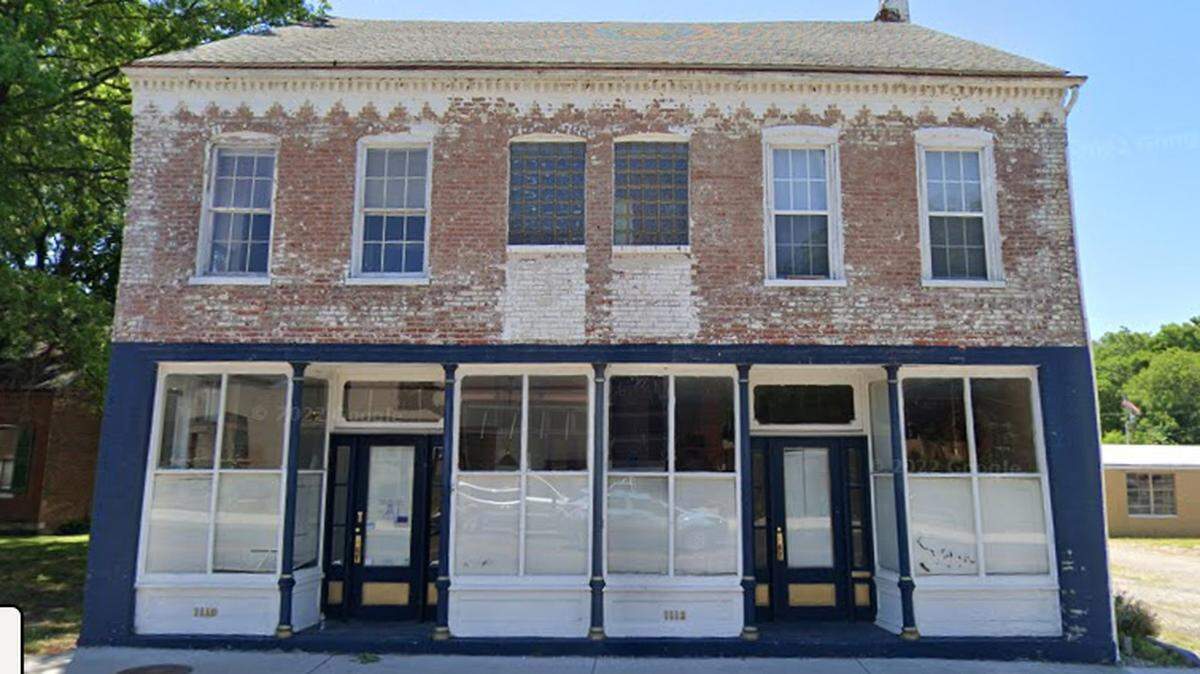 This screenshot from Google Maps shows the historic building located at 1110-1112 W. Main St. in Belleville as it looked before updates to the storefront and exterior colors.