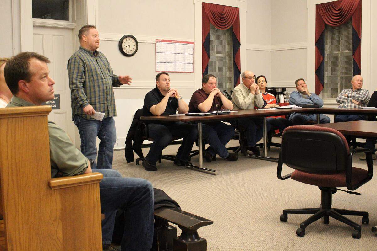 Waterloo resident Rich Harsey, standing, speaks at a meeting of the Monroe County Planning Commission on April 4 as part of a presentation by the Monroe County Fair Wind Coalition.