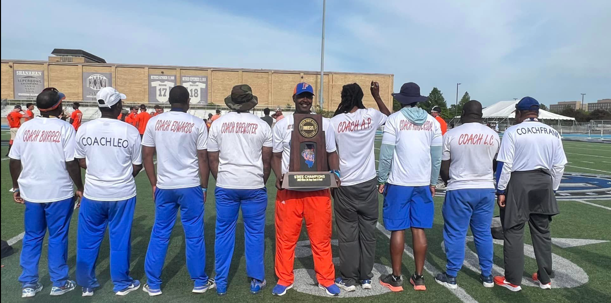 The East St. Louis Flyers Track and Field team earned the IHSA Class 2A State Championship title on Saturday, May 27 at Eastern Illinois University. Pictured is the coaching staff.