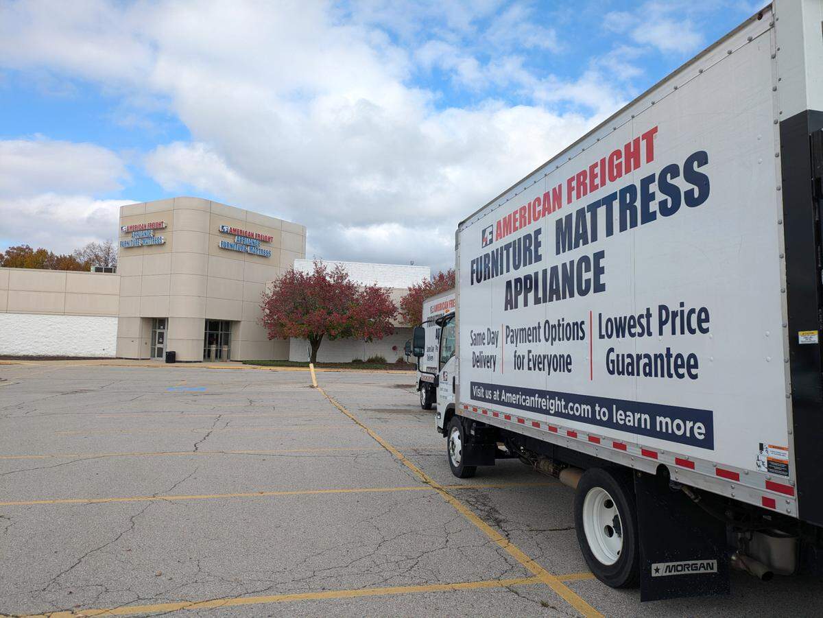 Two delivery trucks sat in the parking lot of American Freight in Fairview Heights on Wednesday, Nov. 6.