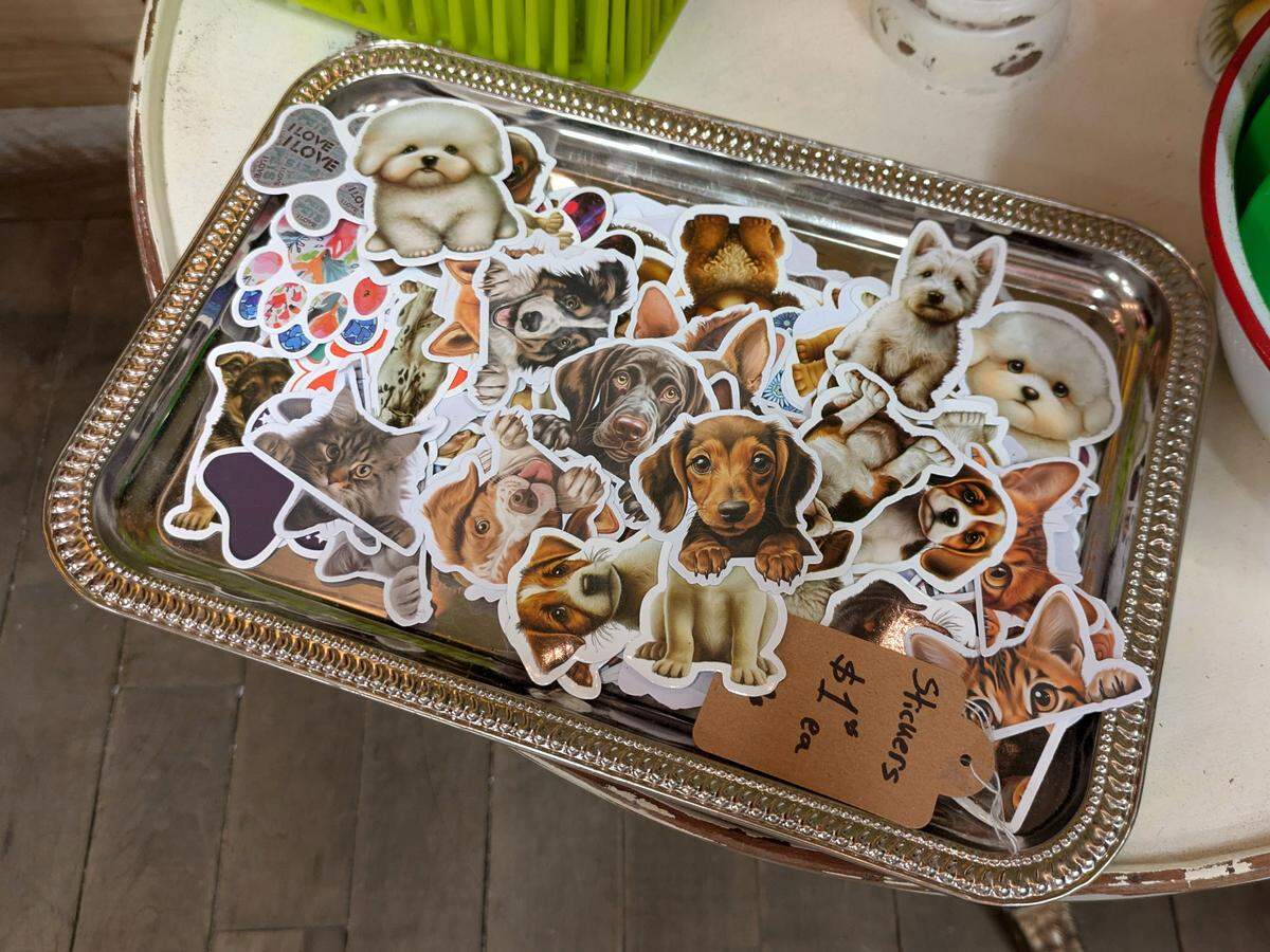 Dog stickers are one of many dog-themed items on display in JuJu Baby’s boutique at Blanquart’s Rusty Gem in Belleville.