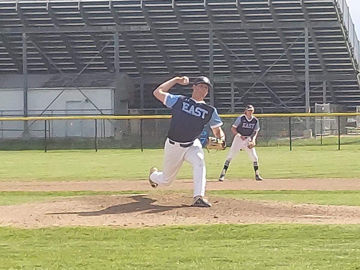 Belleville East pitcher Ean DiPasquale delivers a pitch during a non-conference game against Highland on Monday, May 23, at Belleville East High School. The Bulldogs ultimately defeated the Lancers 9-6.