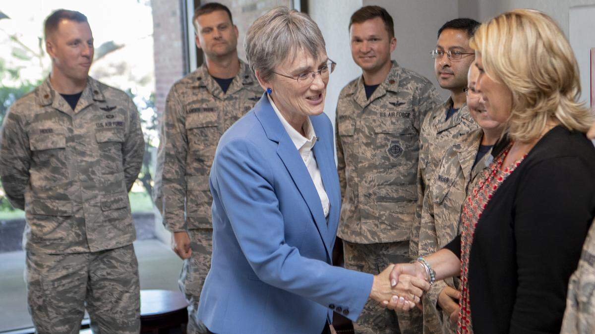 Secretary of the Air Force Heather Wilson shakes with the members of Air Mobility Command that put her visit to Scott Air Force Base together.