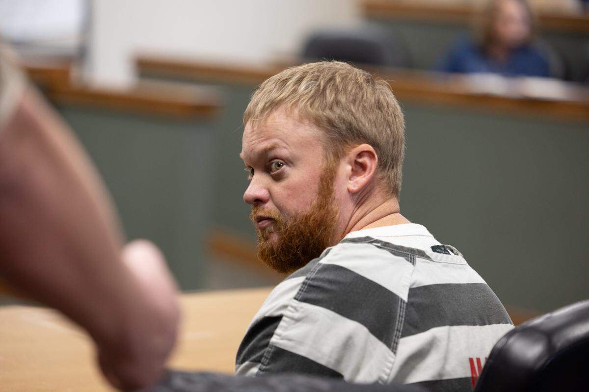 Sammy Shafer Jr., who is accused of hiring two men to murder his estranged wife’s girlfriend, looks back at a bailiff during a court hearing on Feb. 5, 2025.