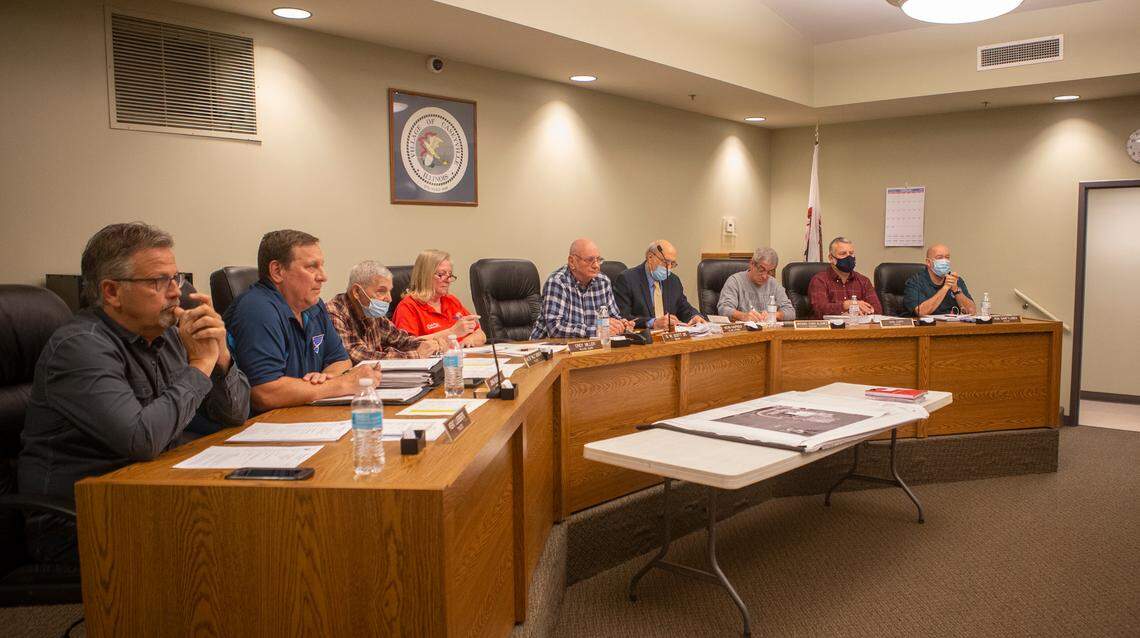 Officials listen to Tanya Fox during the Caseyville Village Board meeting.