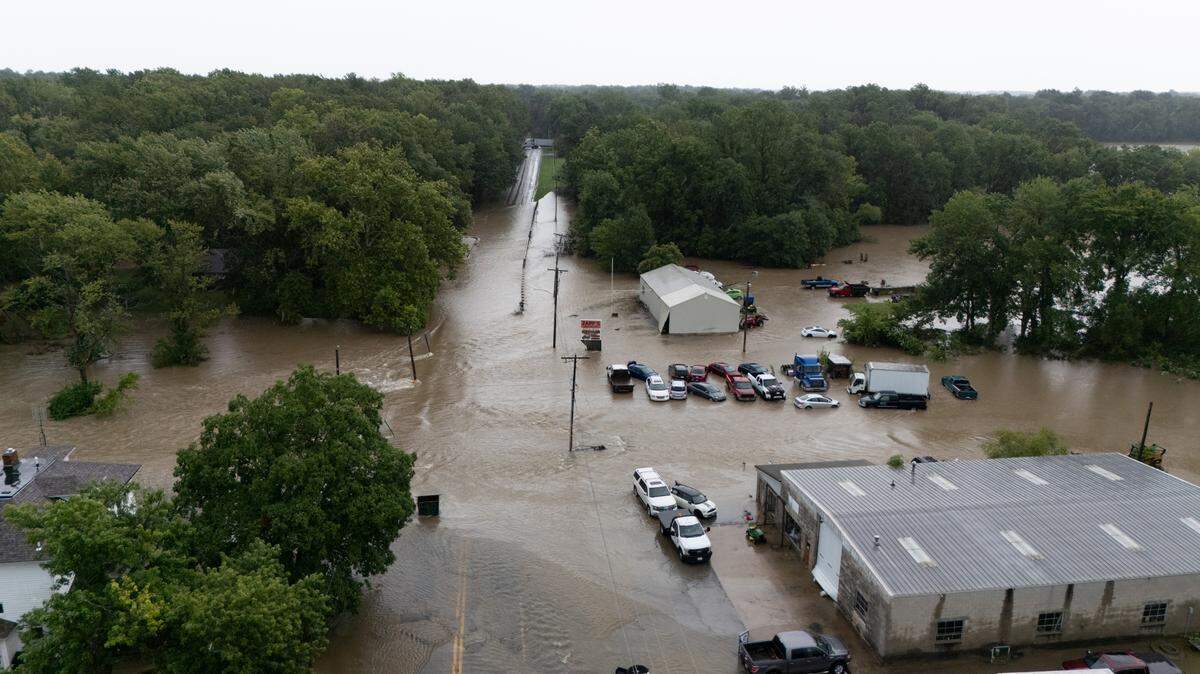 Flooding along E. St. Louis St. in Nashville, Illinois, near where a secondary dam spilled over at the city reservoir, on July 16, 2024.