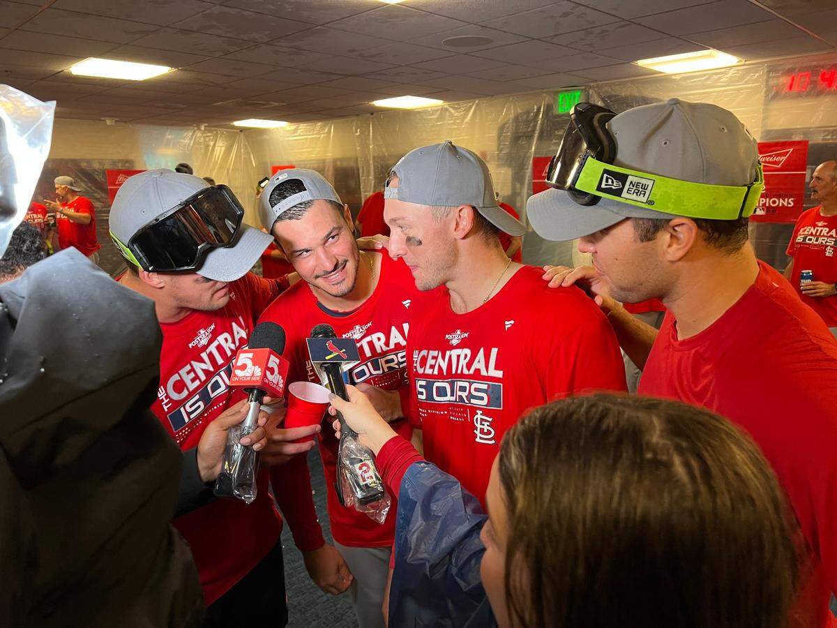 Members of the St. Louis Cardinals are all smiles following the team’s 6-2 victory against Milwaukee on Tuesday night. The win secured the organization’s 12th Central Division crown.