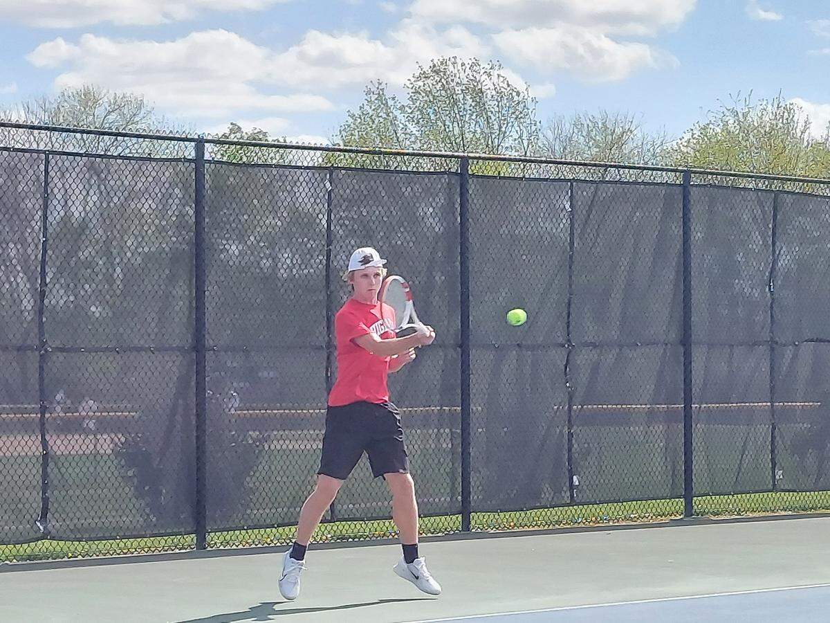 Highland’s Will Lindsco rips back a shot toward the net during his No. 2 singles match against Triad on Monday, May 1, at Highland High School. The Knights ultimately defeated the Bulldogs in the Mississippi Valley Conference match.
