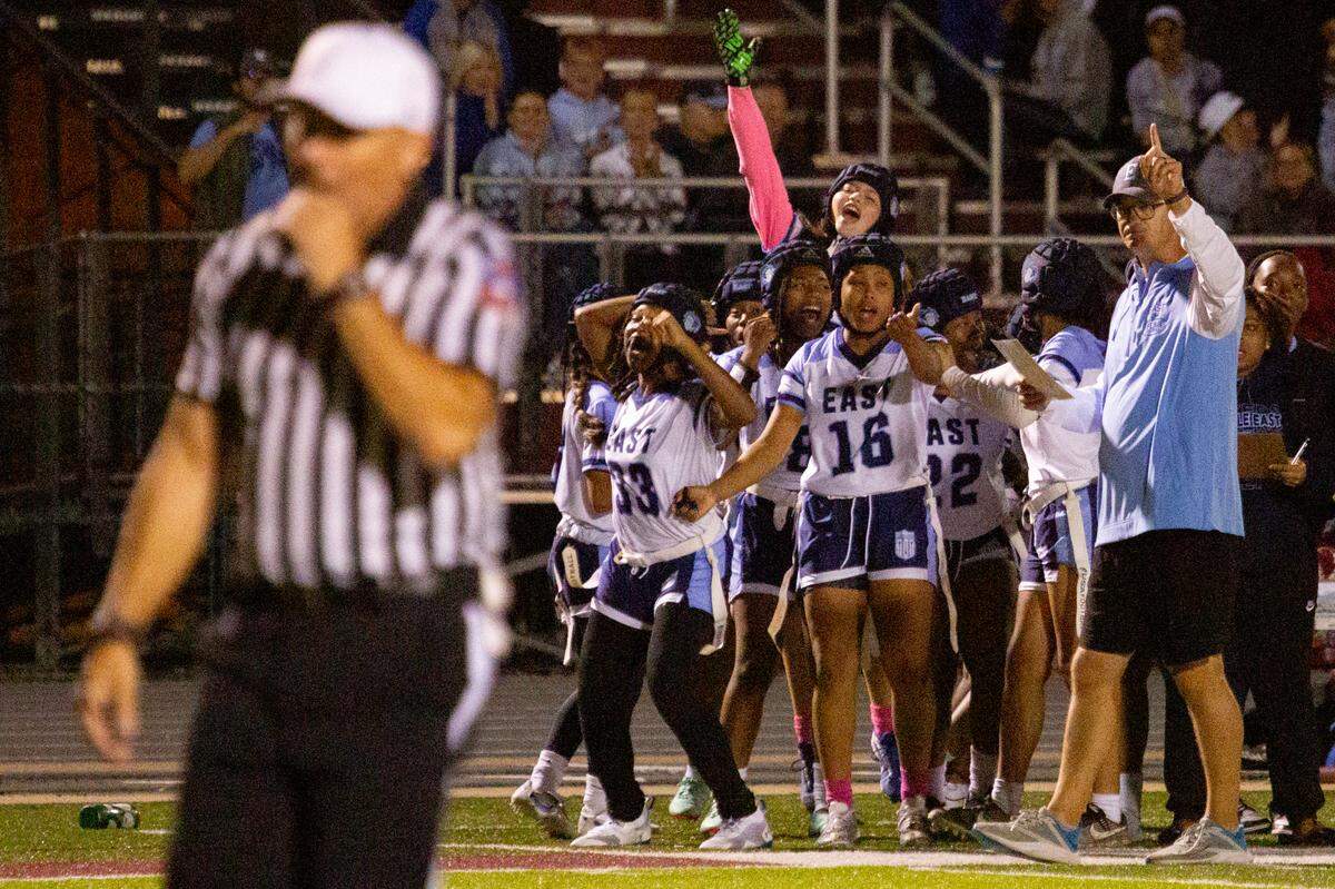 The Belleville East flag football Lancers celebrate a victory on Wednesday, Oct. 2, 2024, at Belleville West High School in Belleville.