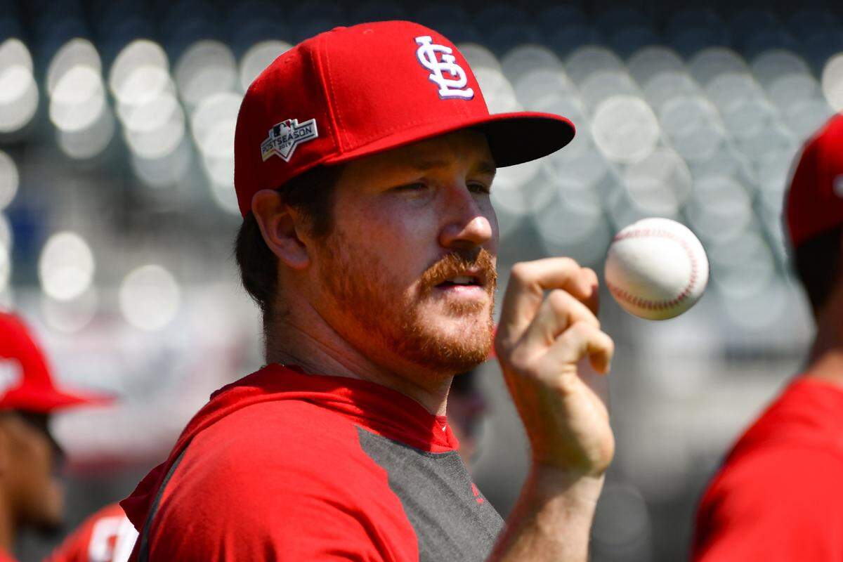 St. Louis Cardinals starting pitcher Miles Mikolas tosses up a ball during a baseball team workout prior to the start of the 2019 NLCS. Mikolas will start the Cardinals’ home opener Thursday and had this to say about it, “I think this is one of the most special or magical opening days in the league ... I’m honored and humbled to get that experience.”