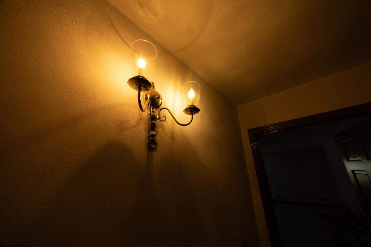 The home also features unique lighting, such as this motion-detecting wall sconce that turns on as a person approaches.