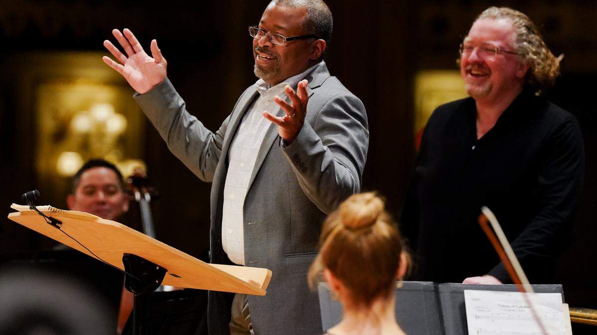Baltimore-based composer James Lee III gives background on his piece to be premiered by the St. Louis Symphonic Orchestra, “Visions of Cahokia,” while next to music director Stéphane Denève on Wednesday, Jan. 25, 2023, at Powell Hall in Grand Center. 