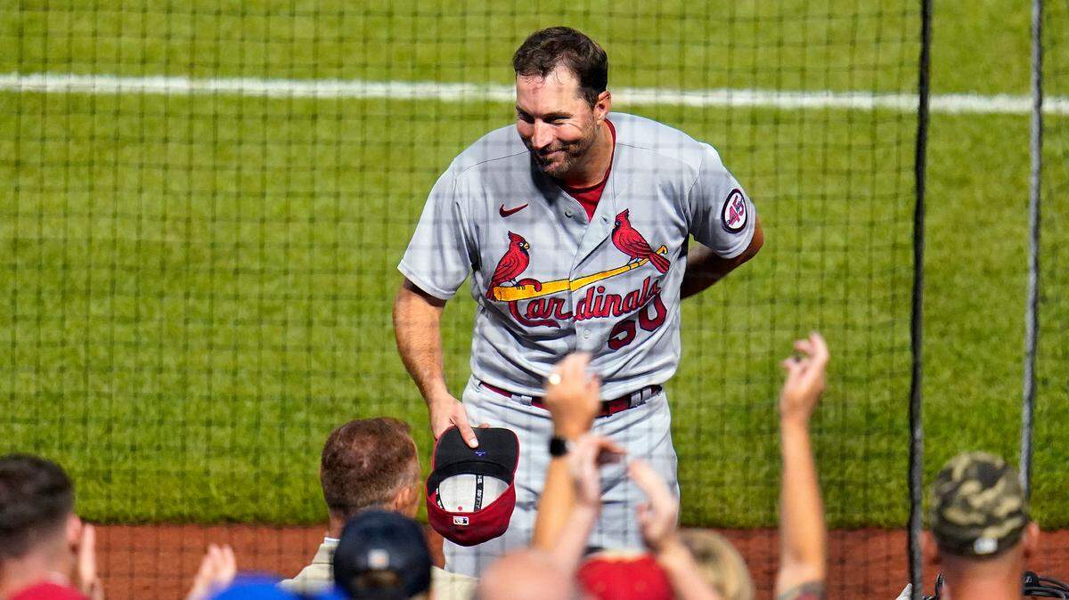 St. Louis Cardinals starting pitcher Adam Wainwright tips his cap to fans after getting the final out of a complete game, two-hit, shut-out of the Pittsburgh Pirates in a baseball game in Pittsburgh, Wednesday, Aug. 11, 2021. He said Sunday he’s eager -- and hopeful -- the 2022 season will start on time despite the ongoing MLB lockout.