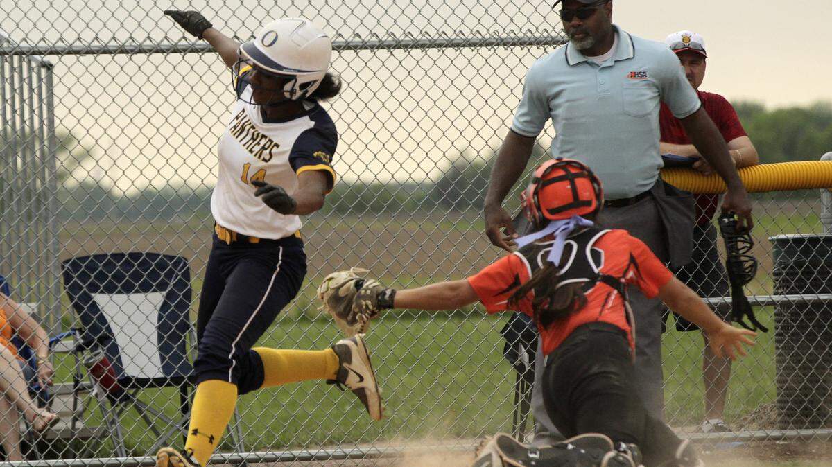 Zoie Howard tip-toes past Edwardsville's catcher to score the Panthers' third and final run against the Tigers on May 15.