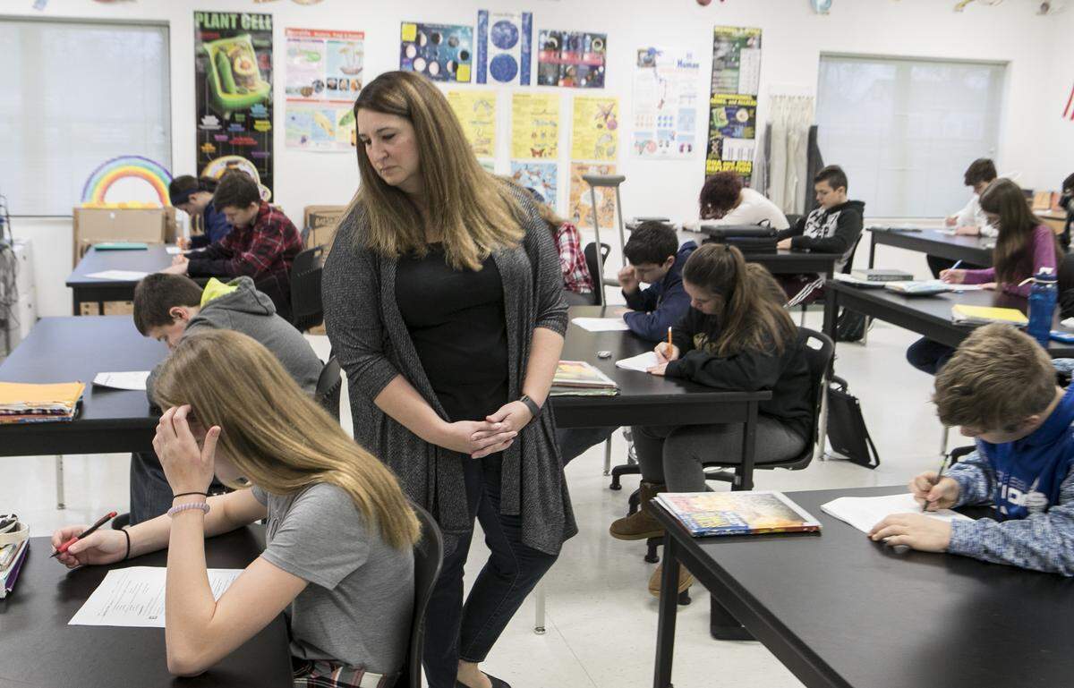 Smithton 7th and 8th grade science teacher Samantha Hedrick watches as students take a science test.