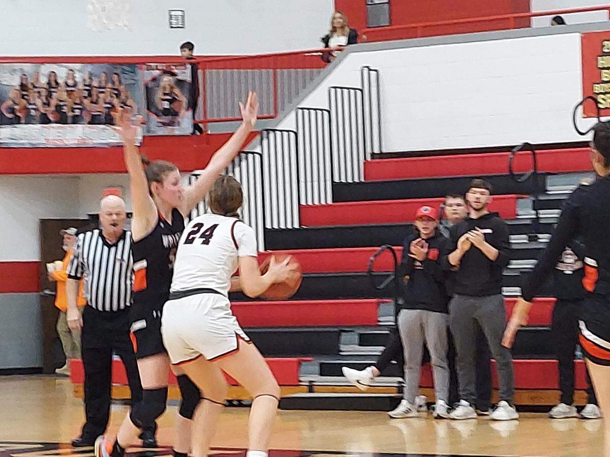 Highland junior post Larissa Taylor goes up for a shot on the baseline against Waterloo senior forward Norah Gum during the IHSA Class 3A Regional championship game Friday, Feb. 17, at Highland High School. Taylor and her HHS teammates ultimately prevailed 52-49.