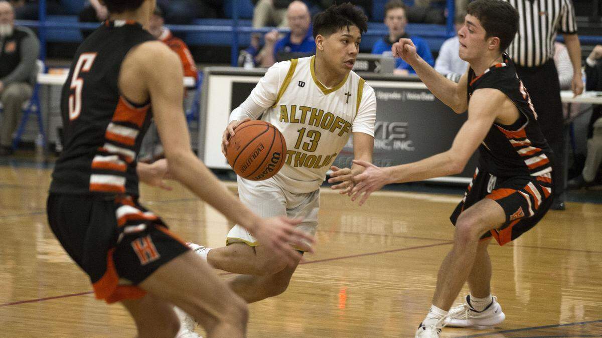 Althoff’s Anthony Reed drives to the basket during the IHSA 3A Freeburg Regional Championship basketball game Friday night in Freeburg. Photo: Chris Johns