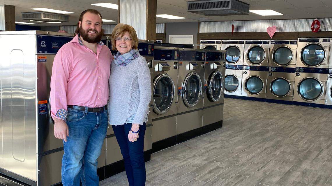 Lakeland Square Laundry owner Aaron Gass with his grandmother, Doris Mueller, who first opened the business with her husband, Gene Mueller, in 1987.