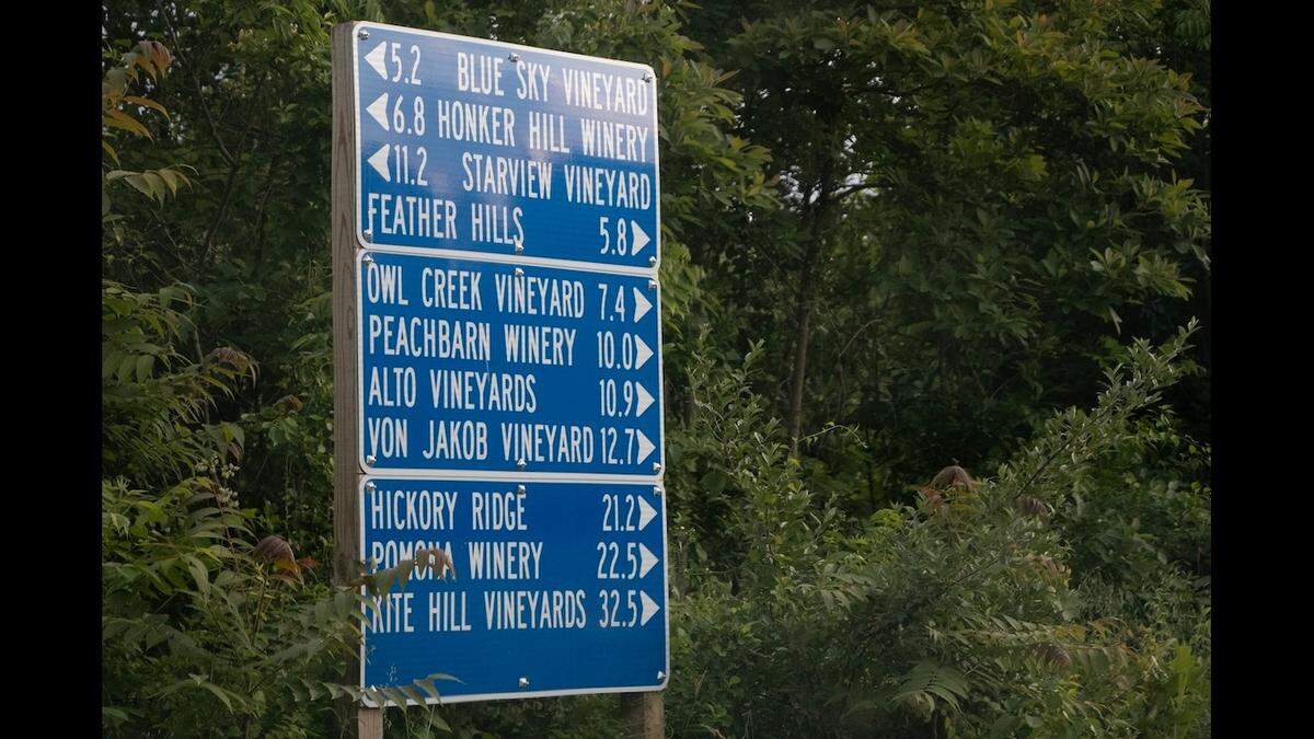 Road sign points to wine trail locations along the Shawnee Hills Wine Trail.