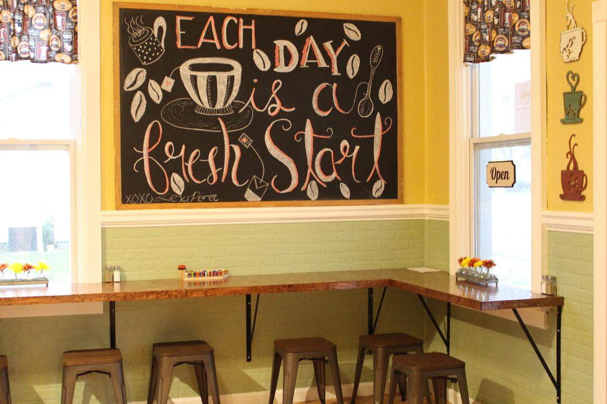Customers at The Red Porch cafe in New Baden can sit at tables or this counter to enjoy coffees, teas, baked goods, sandwiches, wraps, soups or salads.