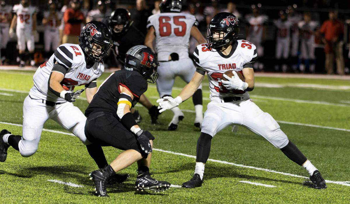 Triad’s Colin Qualls runs the ball during Friday night’s Mississippi Valley Conference road game against Highland. The Knights ultimately dropped a 35-0 verdict.