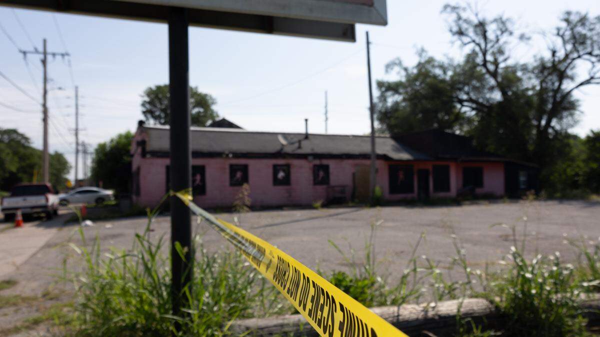 Leftover crime scene tape at DaBlitz Sports Bar and Grill in the 1300 block of North Ninth Street in East St. Louis, Ill. on July 31, 2024. Police said two men were killed and one woman was injured in the shooting.