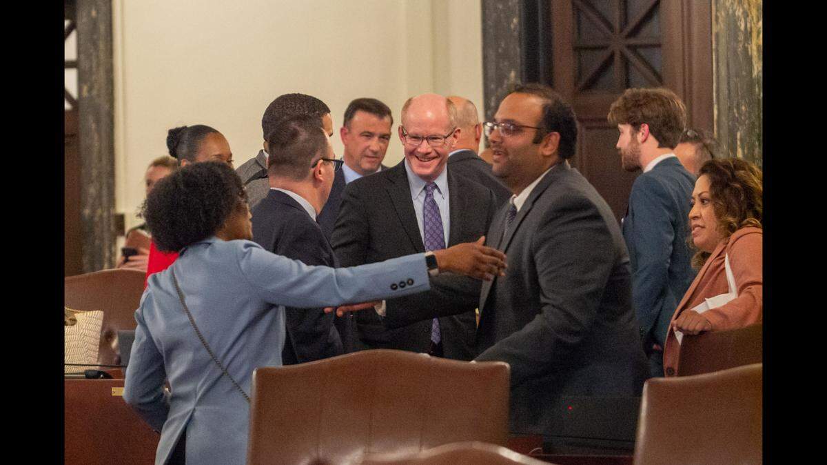 Lawmakers in the Illinois Senate celebrate Sunday night after passing a budget. (Capitol News Illinois photo by Jerry Nowicki)
